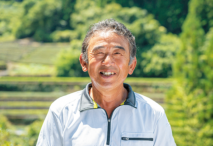 笑顔の徳永毅さんの写真